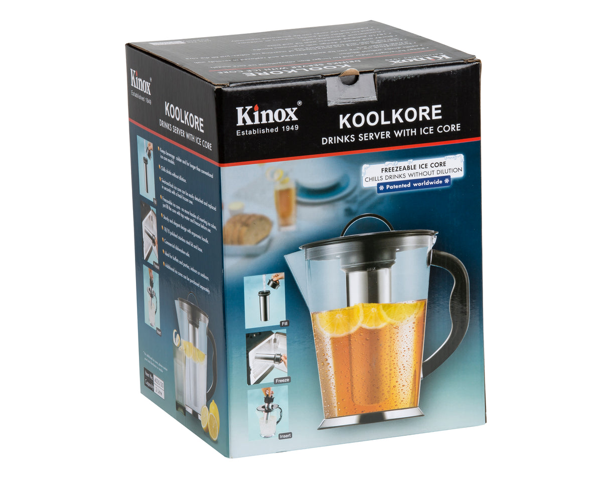 A box of Kinox Koolkore Drinks Server with Ice Core. The black packaging shows a stainless steel pitcher with an orange drink and ice core insert. Text highlights features like “Freezable Ice Core,” “Chills without dilution,” and “dishwasher safe.”.