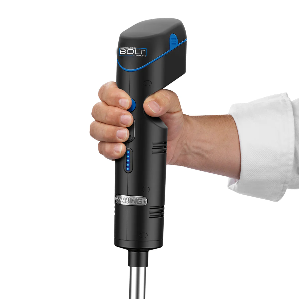 A hand grips a black ANOVA BOLT device with blue accents and buttons, resembling a cordless immersion blender. The person in a white shirt holds it as indicator lights and branding are visible on the body.