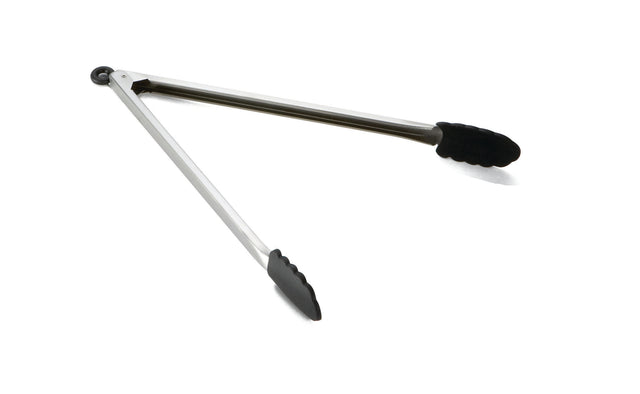 A pair of stainless steel locking tongs with black, scalloped silicone grips on the ends, open in a V shape and resting on a white background.