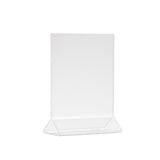 A clear acrylic menu holder with an upright, vertical rectangular display and a slanted base. This two-sided menu display is empty, transparent, and photographed against a plain white background.
