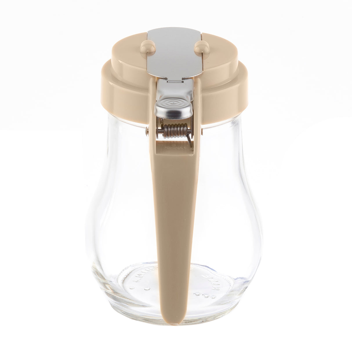 A clear teardrop glass syrup dispenser with a beige plastic lid and handle. The lid features a silver metal flap with a hinged spring mechanism for pouring. This dispenser is dishwasher safe and photographed against a white background.