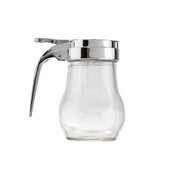 A clear teardrop glass syrup dispenser with a curved body and a shiny silver metal lid and lever handle, isolated on a white background. The dispenser is empty, the lever is raised slightly, and it is dishwasher safe.