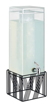 A modern, minimalist 3 gallon beverage dispenser filled with a light-colored liquid sits on a geometric black metal stand. The tall, rectangular container is BPA free and features a metal spigot near the bottom for easy pouring.