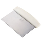 A metal dough scraper with a rectangular stainless steel blade and a white curved plastic handle. The subtle circular logo sits at the center, and the tool is dishwasher safe—perfect for cutting or lifting dough during baking tasks.