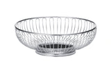 A round, chrome plated wire basket with vertical and curved metal rods forming its sides. This open, airy TableCraft basket features a solid circular base and rests on a plain white background.