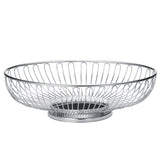 A round, chrome plated Chalet Basket by TableCraft Products sits empty. Its open design features evenly spaced vertical metal rods and a solid circular base, while the metallic finish adds a sleek, modern touch to any setting.