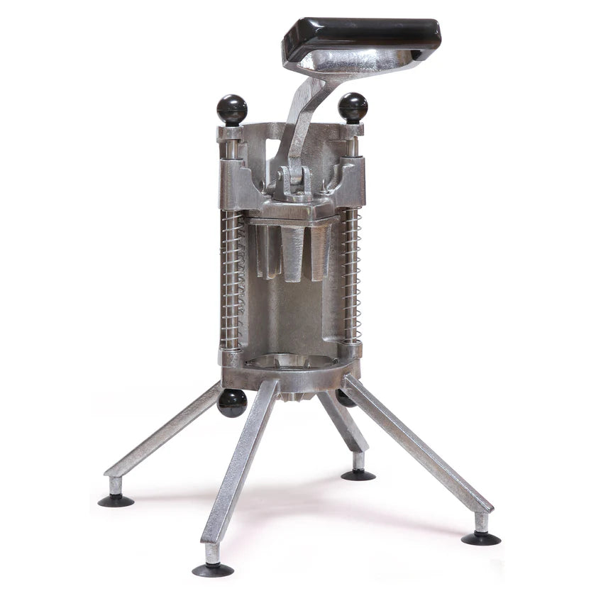 A metal French fry cutter with a black handle, cast aluminum cylindrical body, and four angled legs with suction cups for stability. The lever is raised, showing the grid blades inside where potatoes—or even apples—can be pushed through to make fries.