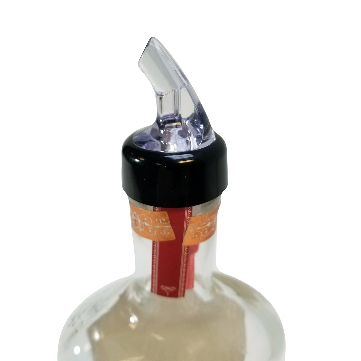 A close-up of a bottle with a TableCraft black and clear plastic Proper Pour 1 oz. pourer on top. The bottle features a red and gold seal around the neck, set against a plain white background. The angled spout is designed for controlled pouring.