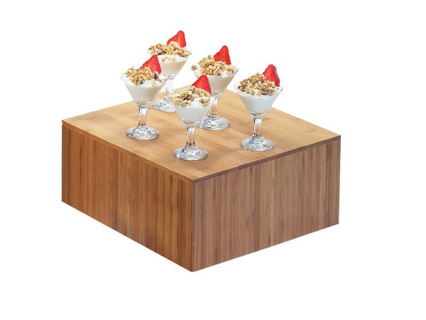 Five glass dessert cups filled with yogurt, granola, and strawberry slices are arranged on a Cal-Mil bamboo riser with a white background. The neatly positioned cups create an elegant and appetizing presentation.