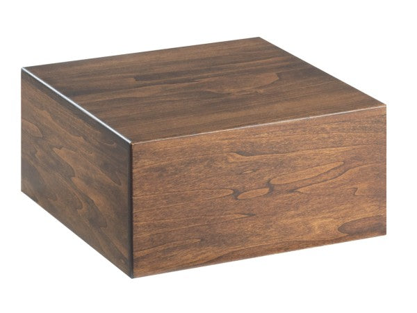 A simple, square wooden box with a smooth walnut finish and visible wood grain pattern. The box is closed, BPA free, and sits on a white background with no visible handles or decorations.