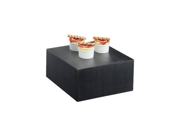 Three small white ramekins with dessert, garnished with sliced fruit and rolled wafers, are arranged on a large, black Cal-Mil display riser against a plain white background.