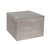 A plain, light-gray Aspen Riser cube sits against a white background. The cube, made from gray-washed pine wood, features visible wood grain and subtle knots for a natural, minimalist look with smooth sides and sharp edges.