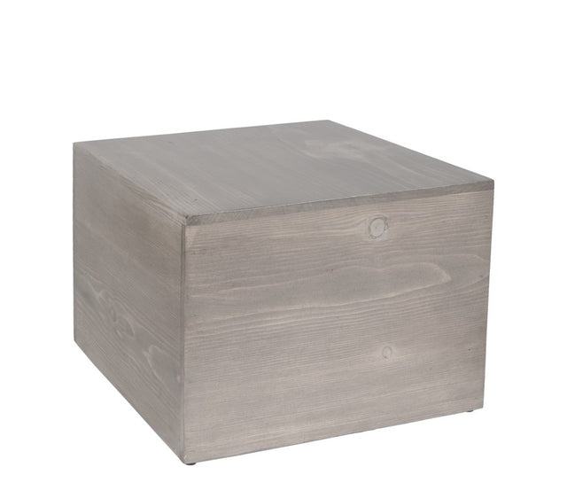 A plain, light-gray Aspen Riser cube sits against a white background. The cube, made from gray-washed pine wood, features visible wood grain and subtle knots for a natural, minimalist look with smooth sides and sharp edges.