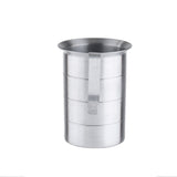 A 4 quart, cylindrical measuring jug with a flat, vertical handle attached to its side. The brushed metal surface features horizontal ridges and graduated measure markings; the empty jug stands upright on a white background.