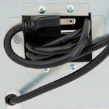 A close-up of a coiled black power cord with a three-prong plug, neatly stored inside a metal electrical box, typical of Empura Refrigeration units like refrigerated merchandisers or models with glass swing doors. Another cable section extends out at the bottom.