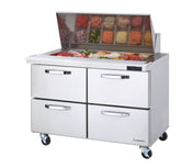 A stainless steel mega top refrigerated prep table with four drawers on wheels, topped with an open compartment displaying various sliced vegetables and ingredients in clear containers, and a digital temperature display on the front.