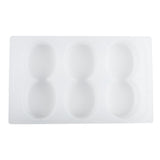 A white silicone mold by TableCraft Products with six oval-shaped cavities arranged in two rows of three, viewed from above. The mold features a smooth surface, rectangular edges, and is dishwasher safe for easy cleaning.