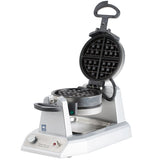 A stainless steel Belgian Waffle Maker with a round, nonstick grid divided into four sections. The appliance is open, showing black waffle plates. A handle is attached to the lid, with control knobs and indicator lights on the front panel.