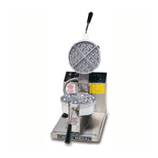 A commercial grade Belgian Waffle Baker with a round gridded cooking surface is open, revealing top and bottom plates. It features a metal body, control knobs, warning labels, and handles for easy opening and closing.