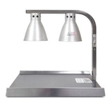 A stainless steel Warma-Serve Food Warmer features two cone-shaped silver heat lamps on a curved bar above a rectangular warming tray, designed to keep food warm in commercial kitchens or buffets. Labels and warning stickers are visible on the lamp and tray.