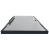 A low-angle view of an Empura Refrigeration gray metal tray with black raised edges, a handle on one short side, and a rectangular cutout near the opposite end. The tray appears flat and smooth, with slightly rounded corners.