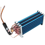 A metal Empura Parts evaporator coil with blue aluminum fins and U-shaped copper tubing features attached insulation on one tube. The assembly has mounting brackets at both ends, with a small filter-drier visible near the copper connections.