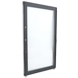 A glass door with a black metal frame is shown standing upright. This Empura Refrigeration door (right) features a lock and handle on the right side, with three circular metal fixtures along the left edge. The background is plain white.