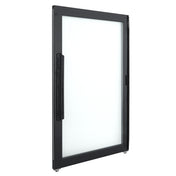 A black-framed glass door stands upright at an angle, showing both its handle and thin frame. The Door Left handle is long, vertical, and ridged—ideal for Empura Refrigeration units with a modern, minimalist design.