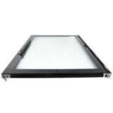 A rectangular, black-framed glass panel—likely an Empura Refrigeration Door Left—with mounting hardware at each corner, viewed from a low angle. The panel has a handle on one side and appears to be an enclosure or appliance door. The glass surface is clear and clean.