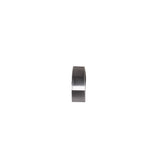 A single, clear roll of adhesive tape sits upright on a white background, shown from a front angle. The tape is wound around a plastic core and placed beside a sleek stainless steel speed rail, highlighting its cylindrical shape.