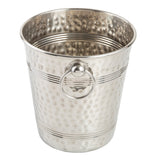 A shiny, stainless steel ice bucket with a hammered texture, horizontal grooved lines, and a round metal handle ring attached to the side. The TableCraft bucket is empty and photographed against a plain white background.