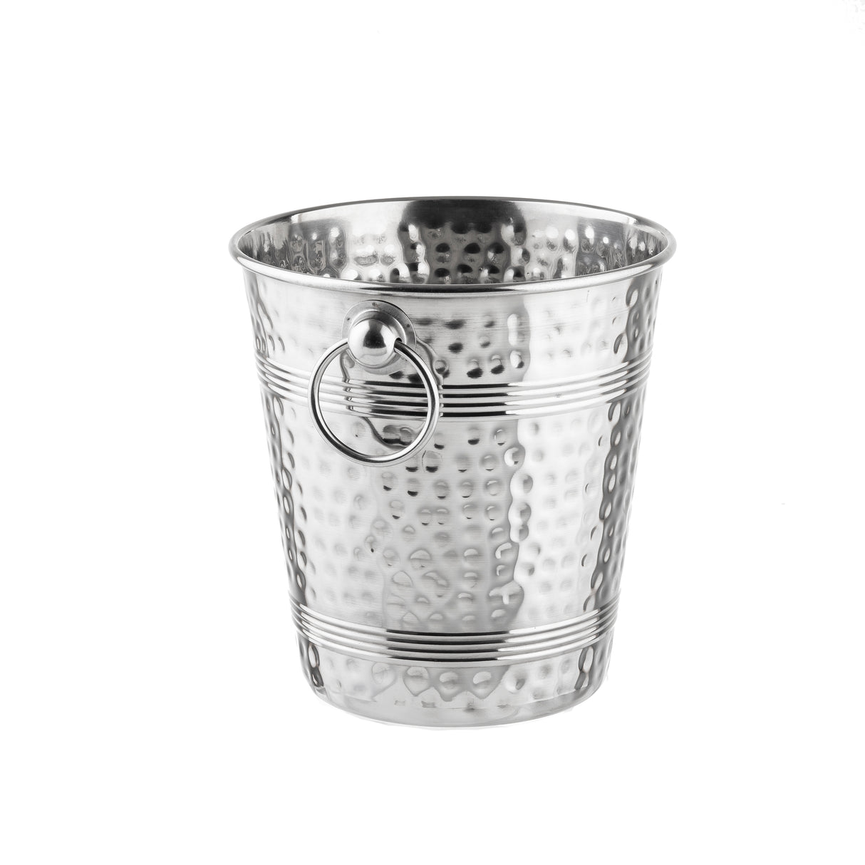 A shiny, silver stainless steel ice bucket with a hammered texture, horizontal ridges, and a round handle ring attached to its side. The TableCraft bucket is empty and placed on a white background.