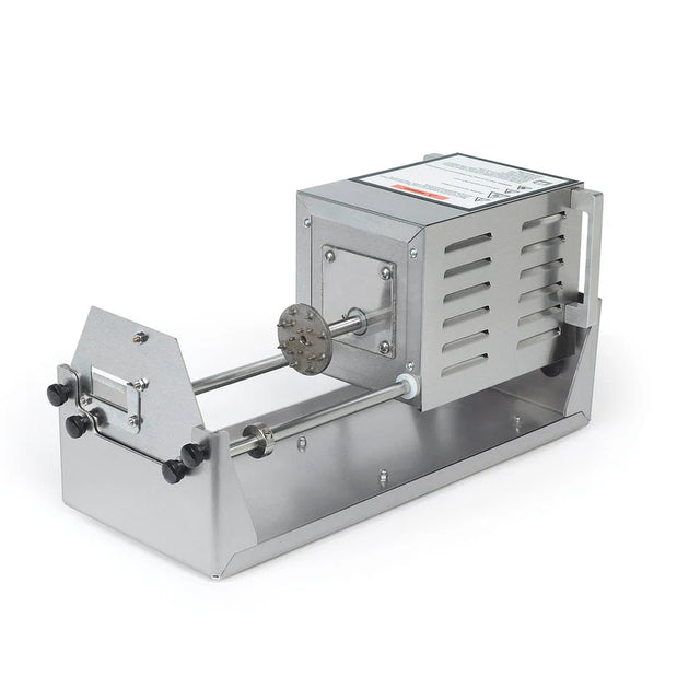 A stainless steel pasta extruder with a boxy motor housing, slotted vents, handle, and a die plate for shaping pasta—similar in build to a stainless steel fry cutter. Two parallel rods support the die, with control knobs on the front and a shallow tray base.
