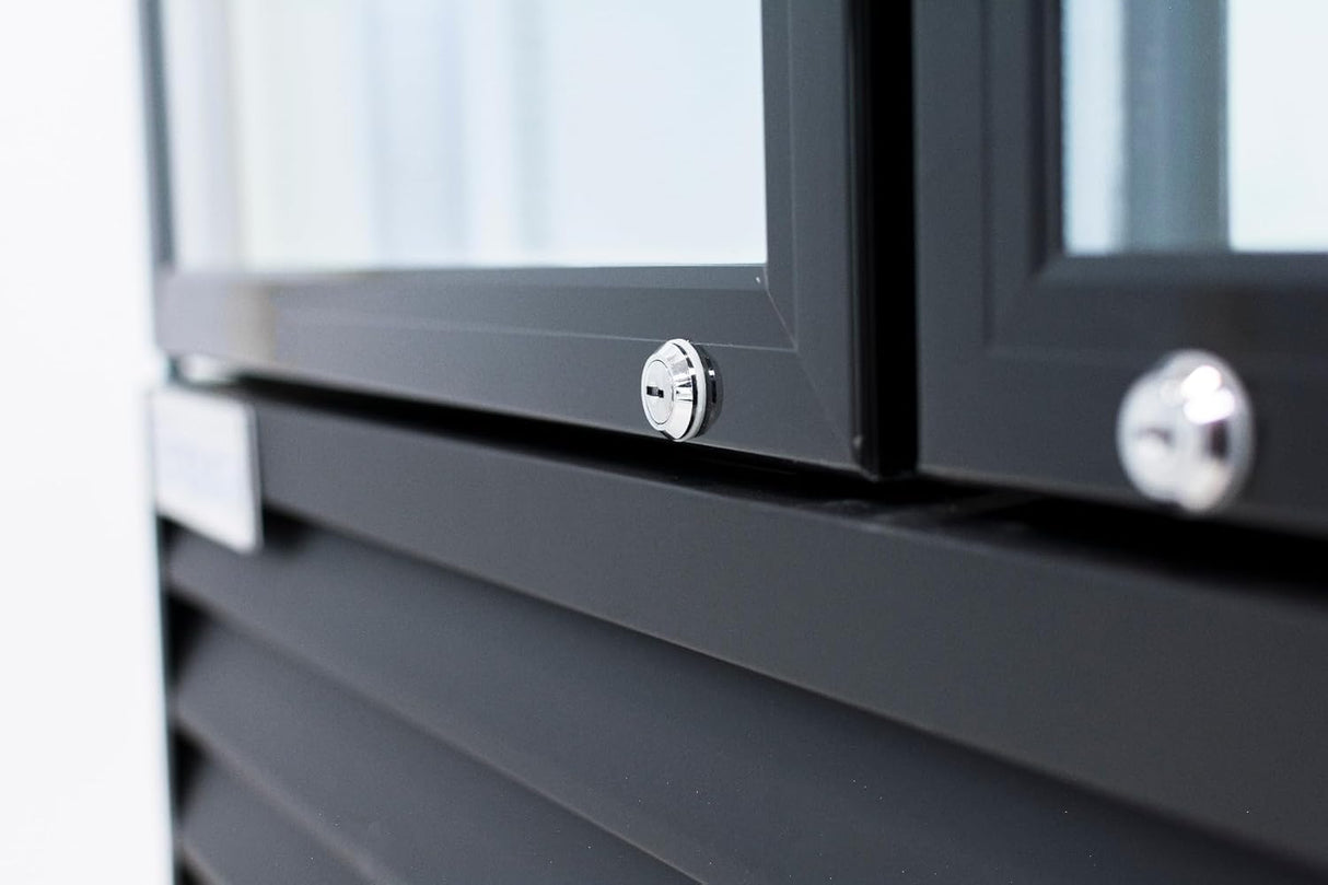 Close-up of a sleek, modern black metal window frame with a shiny silver screw at the center, resembling the sharp edges and reflective glass of an Empura EGM-50B commercial refrigerated merchandisers temperature-controlled display.