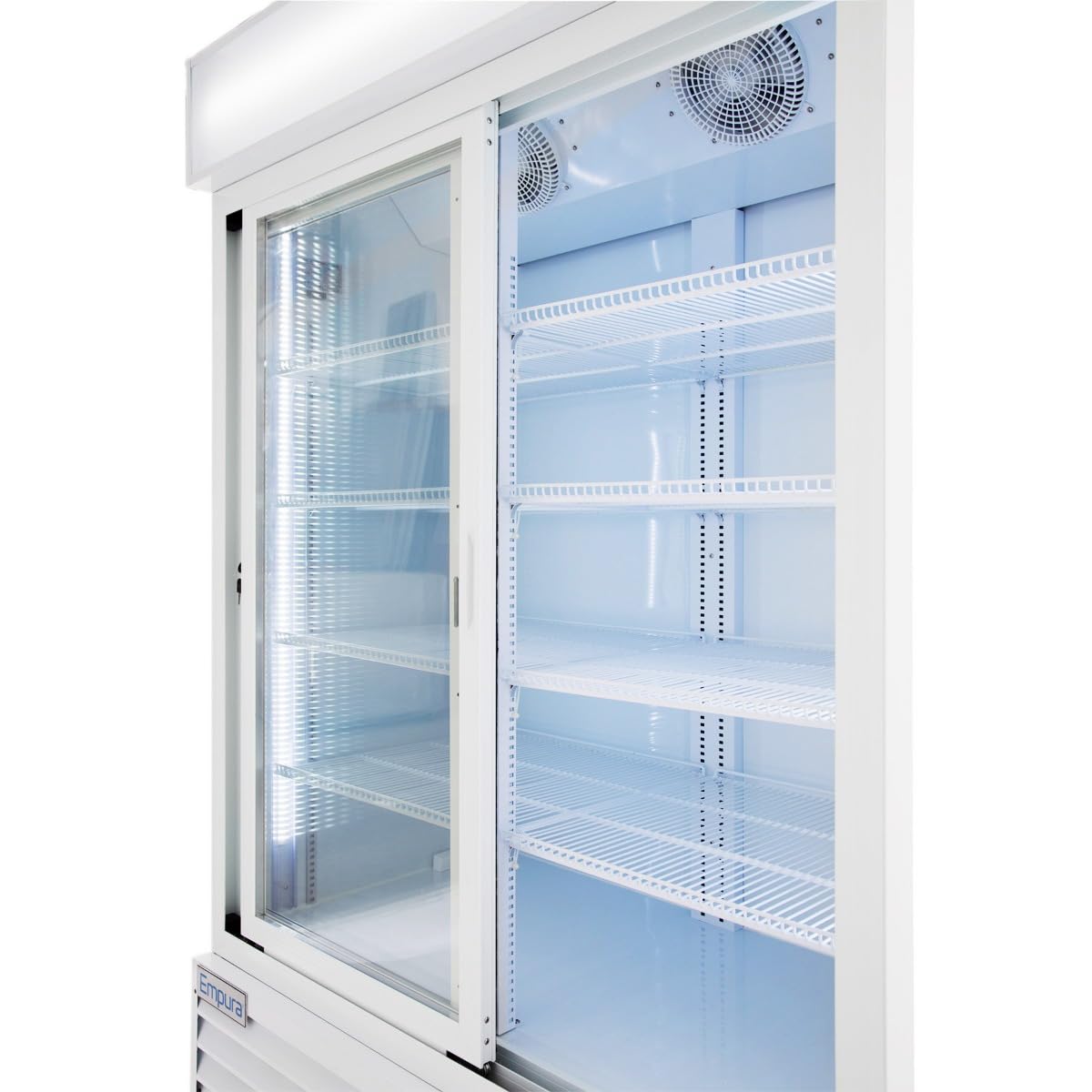 An Empura Refrigeration unit is shown open and empty, featuring two glass sliding doors. Inside, white wire shelves are evenly spaced beneath bright lighting with two cooling fans at the top, giving this refrigerated merchandiser a clean, modern look.