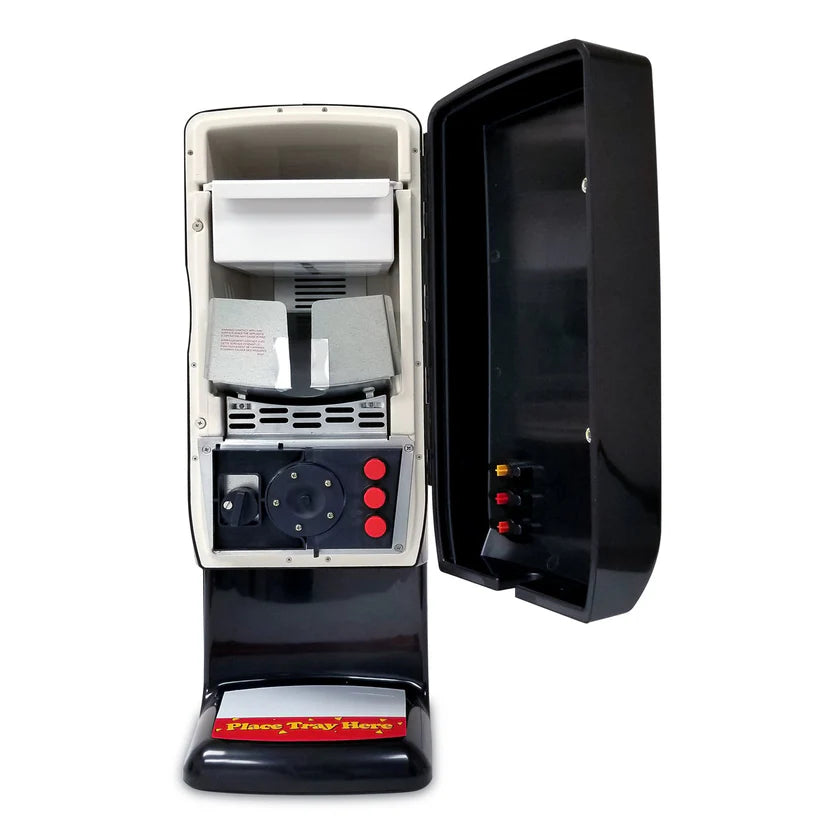 A close-up of an open, upright black and white popcorn machine with visible interior parts—including a popping chamber, heating element, red control buttons, and a Nacho Cheese Dispenser—plus an open door revealing the “Time For Treats” tray at the base.