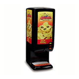 A black Nacho Cheese Dispenser labeled “El Nacho Grande” features a peristaltic pump for smooth bagged cheese flow. The close-up image shows nachos with cheese and olives. Three red buttons and “Great Tasting!” in yellow complete the design.