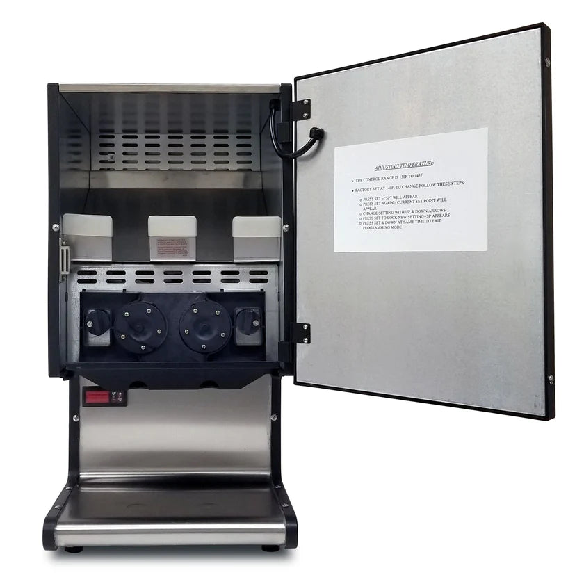 A commercial toaster with a stainless steel exterior is shown with its front door open, revealing three rotating heating elements inside. Similar to a nacho dispenser, it features an instruction sheet attached to the inner side of the open door.