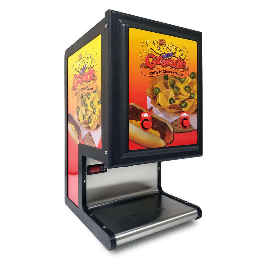 A black and silver nacho dispenser features colorful El Nacho Grande branding with images of nachos, chili, and cheese sauce. Equipped with dual peristaltic pumps, the machine has a tray at the bottom for dispensing cheese sauce.