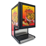 A black and silver nacho dispenser features colorful El Nacho Grande branding with images of nachos, chili, and cheese sauce. Equipped with dual peristaltic pumps, the machine has a tray at the bottom for dispensing cheese sauce.