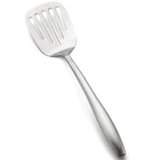 A stainless steel Dalton Collection Turner, this slotted turner features a wide, flat head with vertical slots for draining liquids. The angled utensil has an elongated handle and rests on a white background.