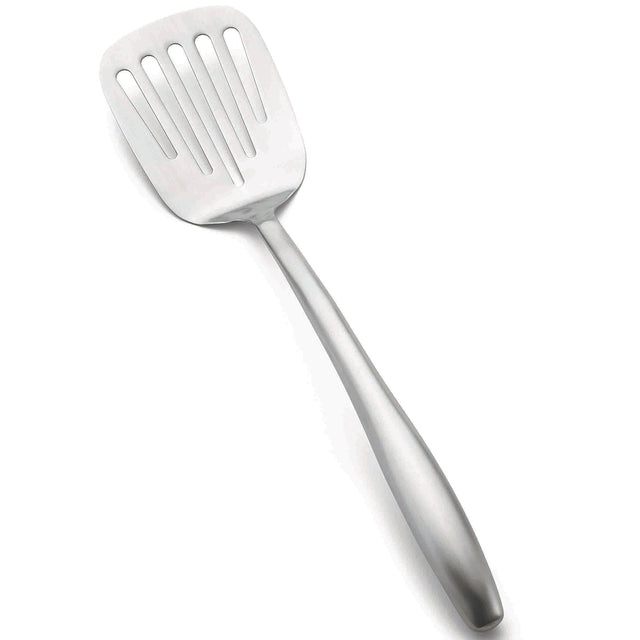 A stainless steel Dalton Collection Turner, this slotted turner features a wide, flat head with vertical slots for draining liquids. The angled utensil has an elongated handle and rests on a white background.