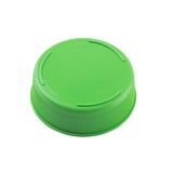 A bright green plastic Invertatop End Cap with a smooth, flat top and ribbed sides for grip, shown against a plain white background. The circular cap is dishwasher safe and features three short, raised curved lines on its top surface.