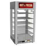 A vertical, stainless steel food display warmer with stainless steel construction and four wire shelves, glass sides, digital temperature control at the bottom, and a top sign reading “HOT & FRESH.” Warning labels are visible near the controls.