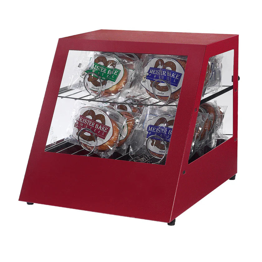 A red, slanted-front pretzel warmer with glass sides contains packaged pretzels. Four “Meister Bake” pretzels in clear plastic bags are arranged on two shelves inside the Gold Medal Products display against a plain white background.