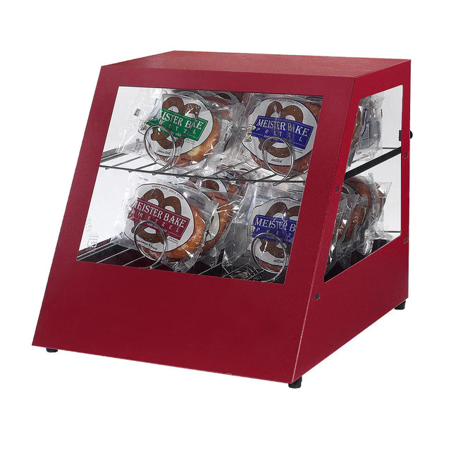 A red, slanted-front pretzel warmer with glass sides contains packaged pretzels. Four “Meister Bake” pretzels in clear plastic bags are arranged on two shelves inside the Gold Medal Products display against a plain white background.