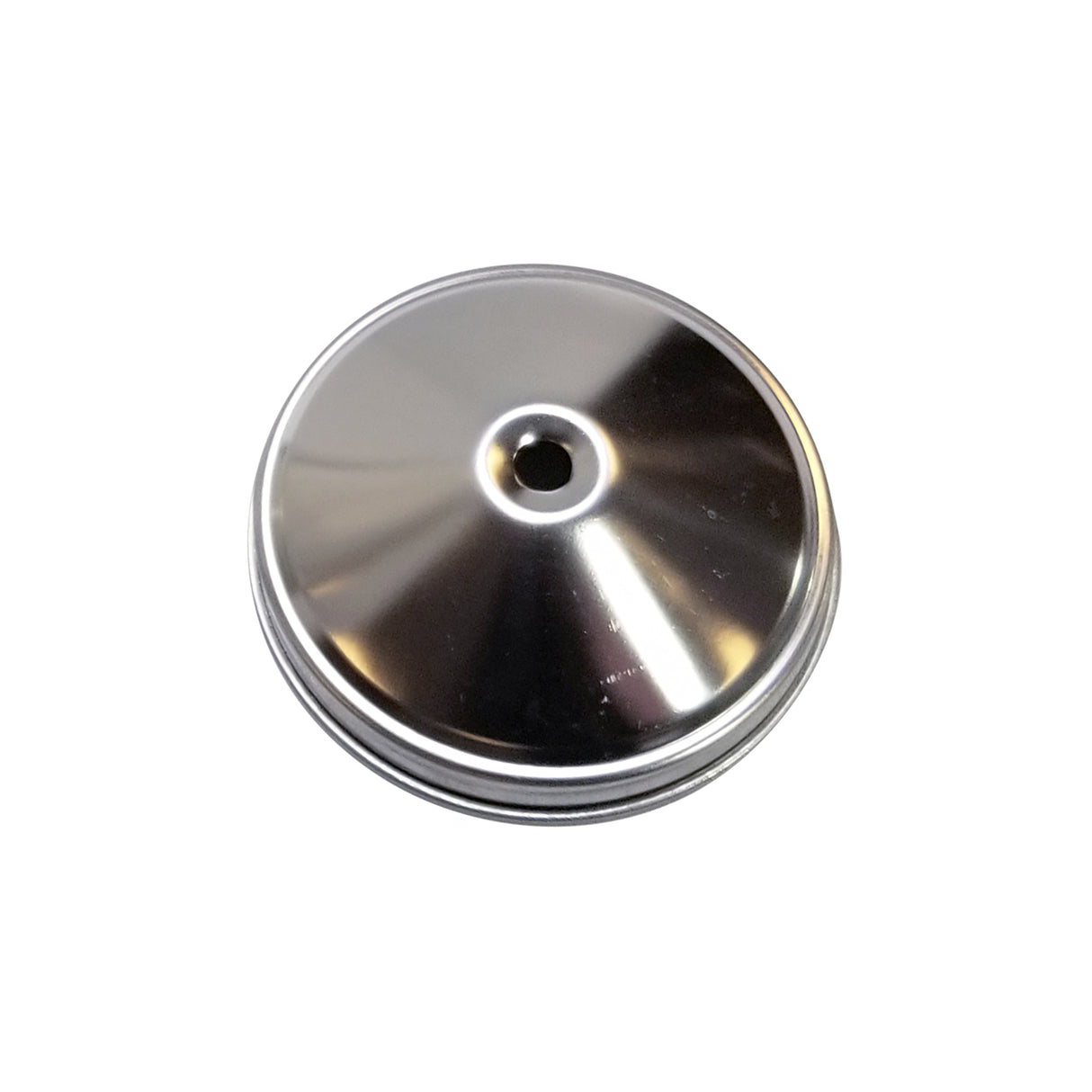 A shiny, metallic, circular object made of stainless steel with a raised rim and central hole is shown against a white background. Its smooth, reflective surface gleams with bright highlights, suggesting it's both durable and dishwasher safe.