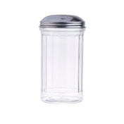 A clear, fluted glass sugar dispenser with vertical ridges and a shiny stainless steel lid featuring a small slot for pouring. The background is plain white.
