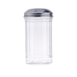 A clear, empty, ribbed glass sugar dispenser with a shiny stainless steel sugar pourer top, featuring a small slot for pouring. The dispenser is shown against a plain white background.
