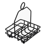 A black powder coated metal wire caddy with four square compartments and a tall handle featuring a circular loop at the top; this TableCraft Products combination rack is perfect for organizing condiments or utensils, and sits on small round feet for stability.